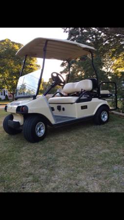 2004 Club Car 48v with tan with new lights and rear flip down seat