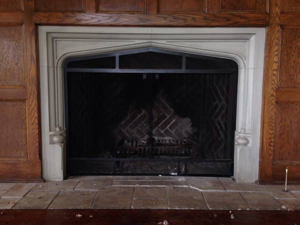 Antique limestone fireplace surround