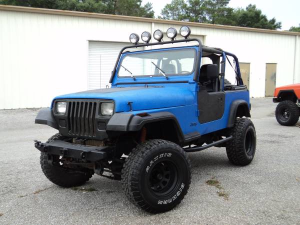 BadAss Black and Blue Rhino Lined Lifted 4x4 Jeep Wrangler TJ 1995