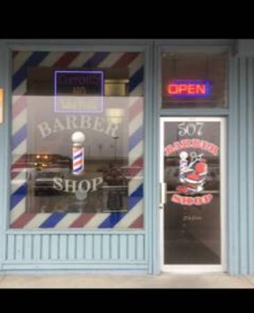 Barber shop haircuts (507 E Northern Lts)
