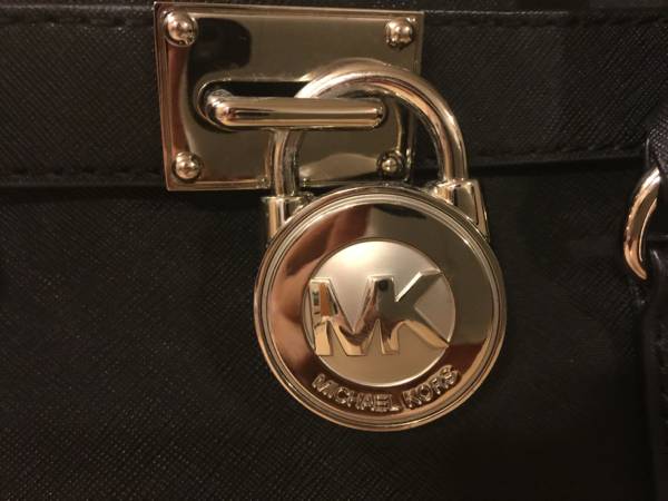Black Michael Kors purse with silver details