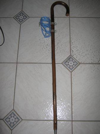 Cane with attached beverage holder