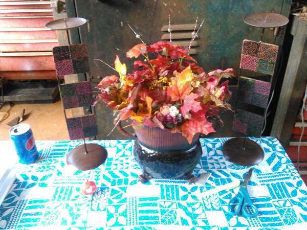 Colorful autumn leaves in  unique bucket amp matching candelabras