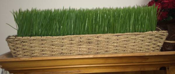Faux grass in basket table decoration