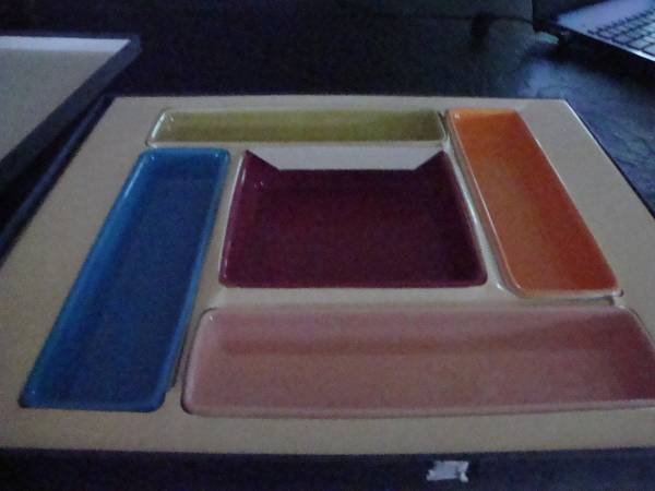 Multi colored sushi, or condiments tray, very, unusual and fun looking