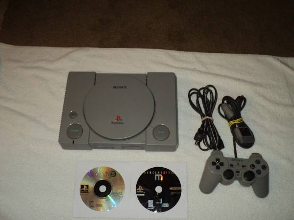 PLAYSTATION 1 SYSTEM WITH 2 GAMES