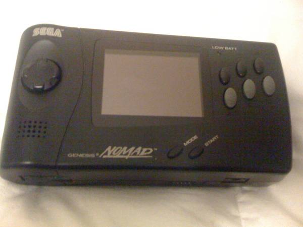 Sega Nomad with ac adapter , and games works great