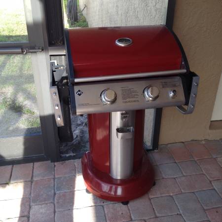 Small gas grill red and stainless steel