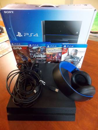 Sony PlayStation 4 Bundle with Sony Gold headset and 4 games