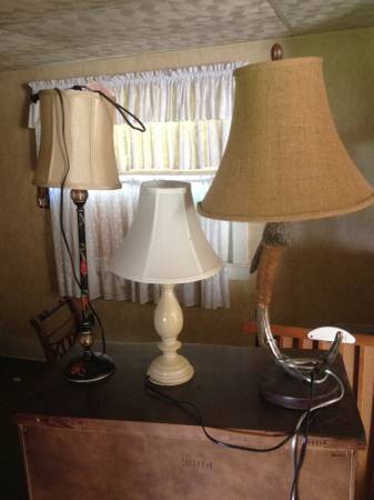 Three table lamps and one tall stand up floor lamp