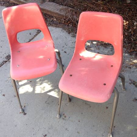 Two pink salmon coral vintage retro school chairs