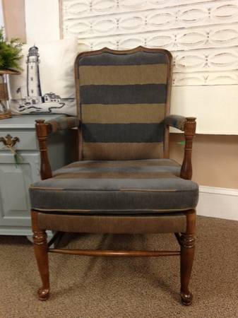 Upholstered blue and gray striped wood arm chair
