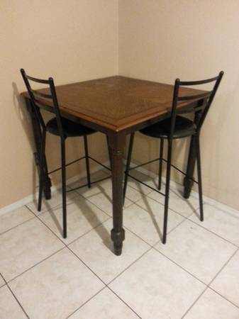 Wooden Table with Black Stools