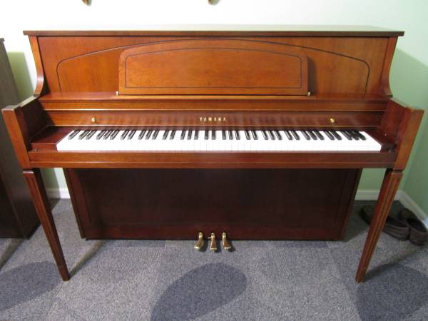 Yamaha Console Piano plays exceptionally well